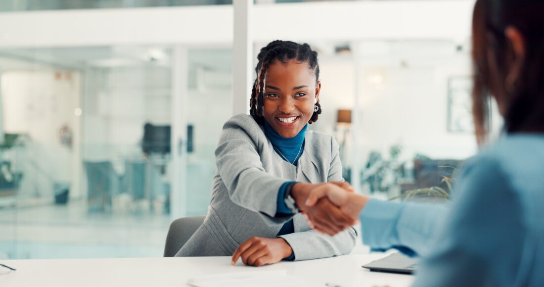 Professionals shaking hands in an office