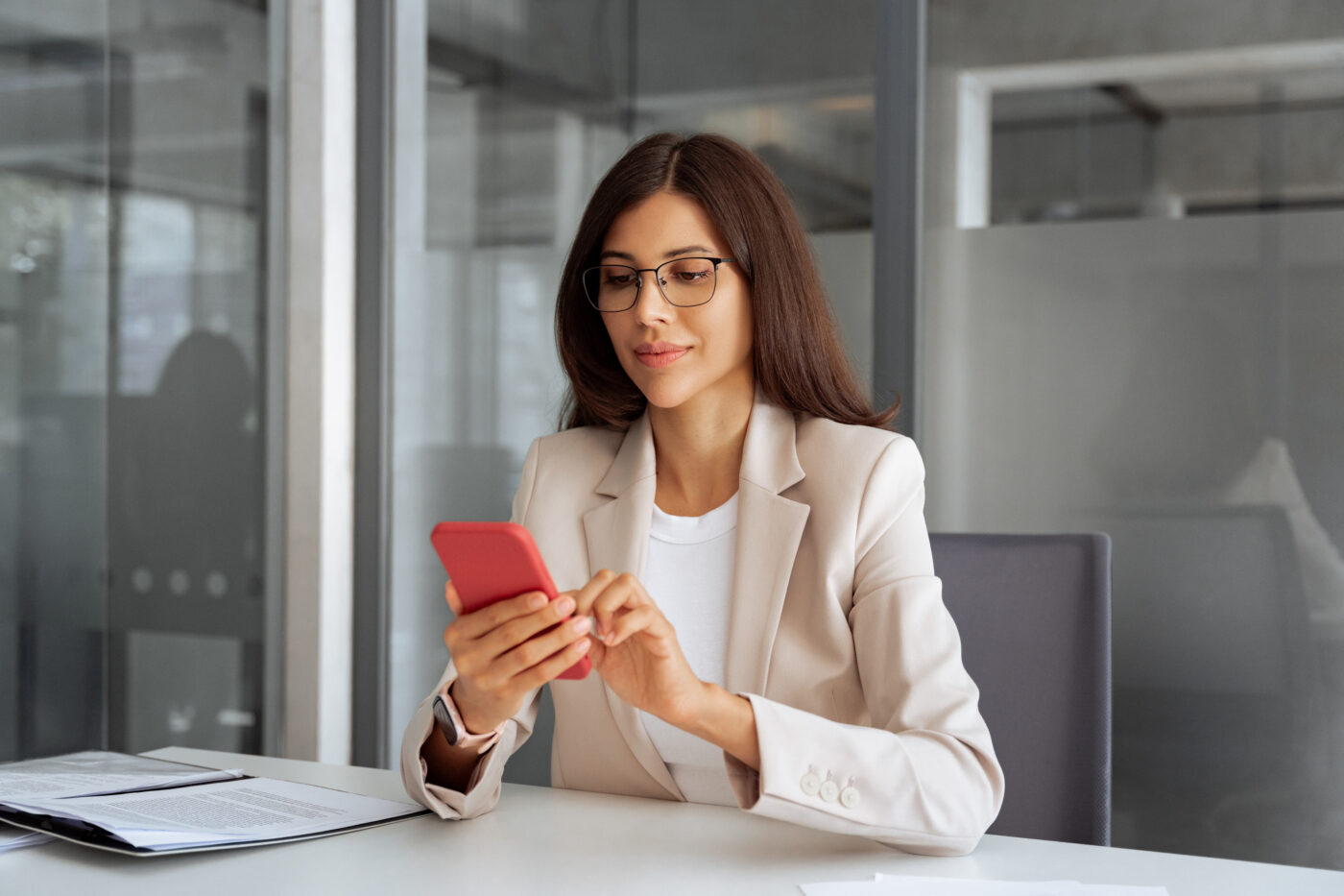 Professional reviewing her phone