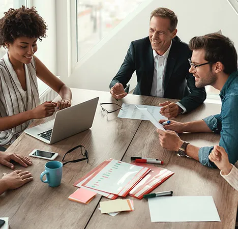 A financial adviser meeting a client at a desk